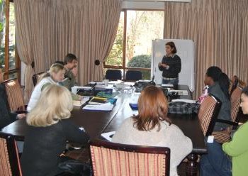 Lygia from Brazil presenting to a group of fellow students and teachers