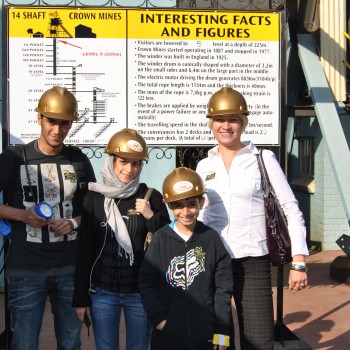 Teacher Julia with Mohamed & Bayan from Saudi Arabia and little Mohamed from Palestine going down the mineshaft at Gold Reef City
